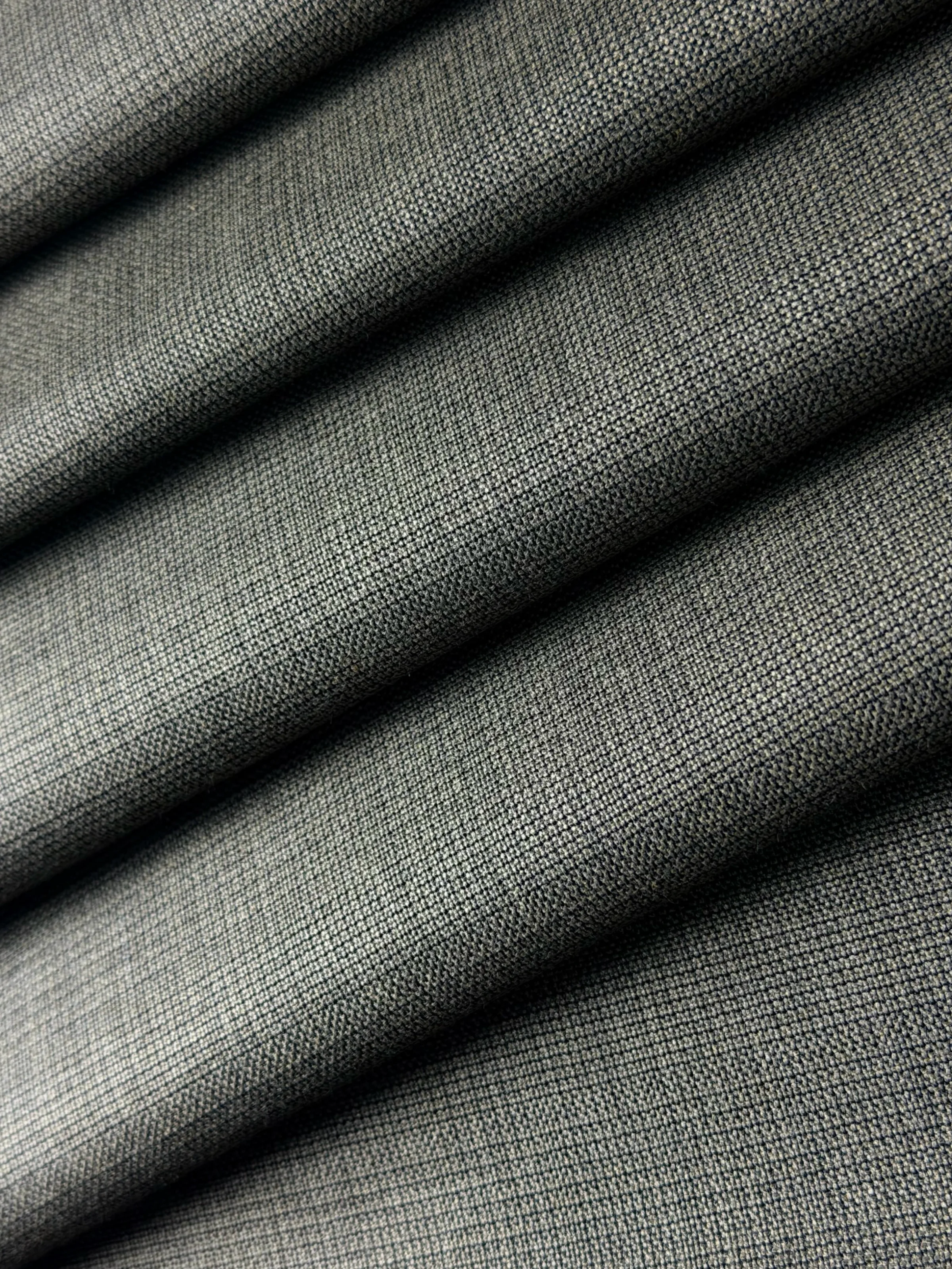 Ash Grey Micro Basket Weave Suiting Fabric On the bench